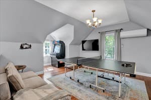 The Happy House | Pocono Vacation Rental | Games, laughs, and memories – it's all happening in our game room! We have pool, foosball, ping-pong, mini air hockey, chess table, arcade machine & large connect 4.}