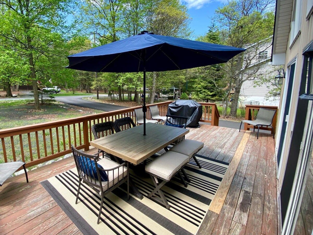Four Seasons Retreat | Pocono Vacation Rental | Enjoy a BBQ party with the gas grill and deck seating}