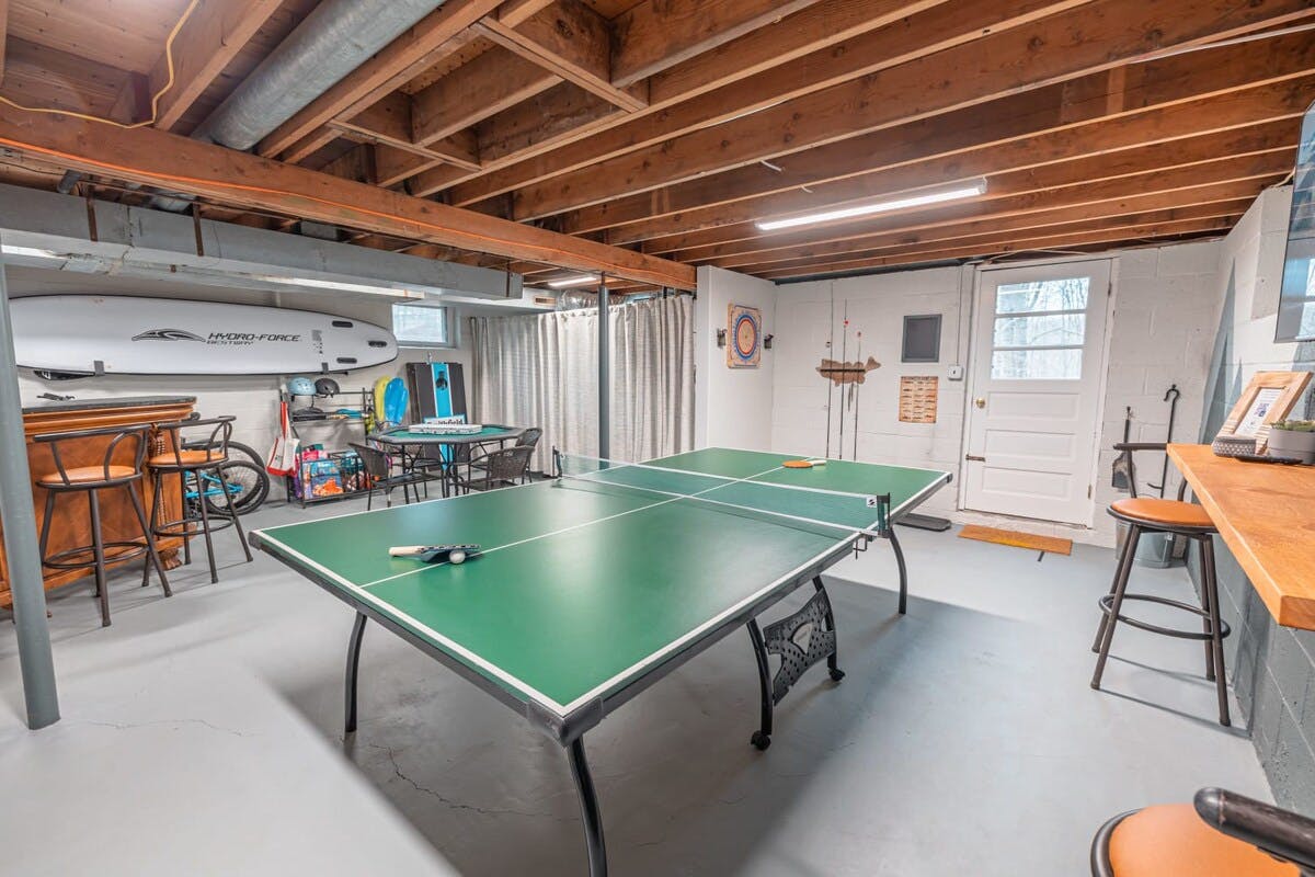 Soleil Chalet | Pocono Vacation Rental | This game room will allow the whole family to have plenty of time to socialize and spend time together while they play.}