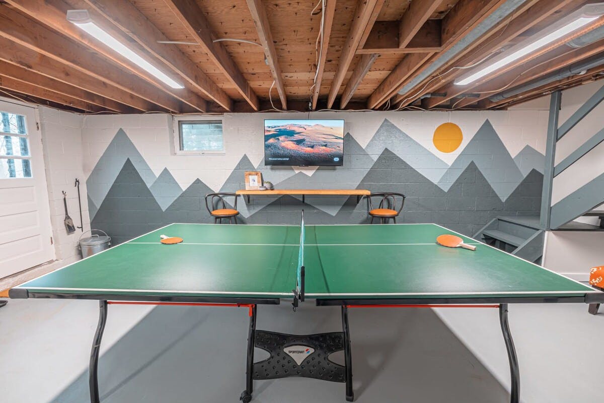 Soleil Chalet | Pocono Vacation Rental | Playing ping pong is a fun family activity. It's also a great way to exercise and get the whole family moving.}